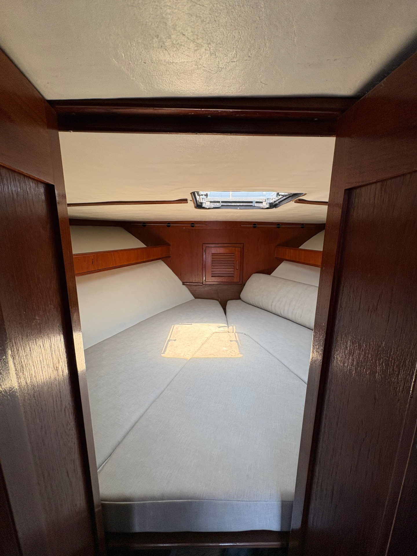 Forward V-berth cabin with new upholstery and overhead hatch