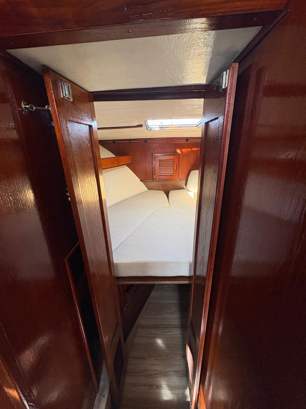 Master cabin doorway with V-berth and skylight